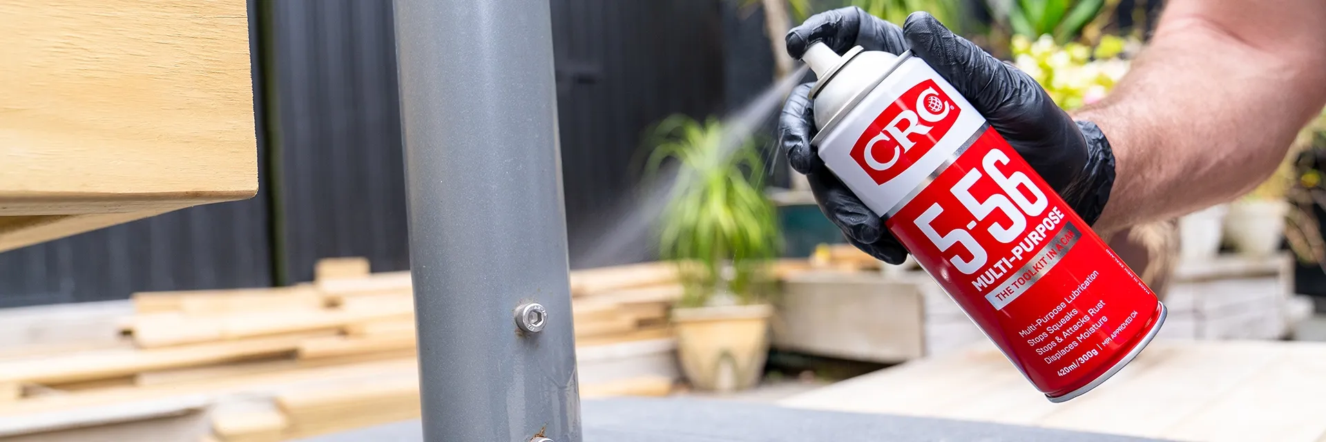 Man using CRC 5-56 lubrication spray